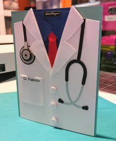 a card made to look like a doctor's coat and stethoscope