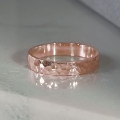 A classic design, with interest added using a hammer finish to catch every gleam of light. Made in SCS recycled rose gold, a versatile every day ring or striking addition to a wedding set. Design Specifications: - Type: Ring - Material: SCS recycled rose gold - Width: 3.5mm - Thickness: 1.2mm - Finish: Hammered | Polished - Profile: Flat Wedding Set Design, Rose Gold Band Ring, Gold Rings Simple, Hammered Rings, Rose Gold Wedding Bands, Everyday Rings, Rose Gold Band, Rose Gold Jewelry, Wedding Set