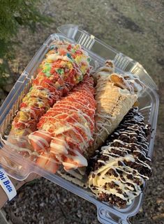 a plastic container filled with different types of desserts