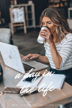 a woman drinking coffee while using her laptop