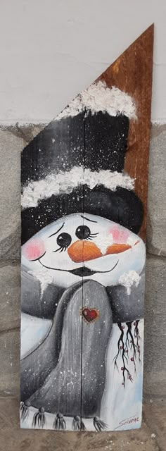 a snowman painted on the side of a building