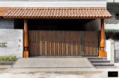 an entrance to a building with wooden doors