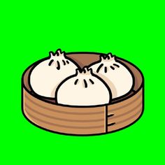 two dumplings in a wooden container on a green screen