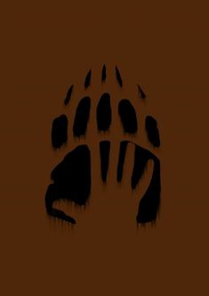 an animal's paw print on a brown background