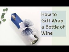 a wine bottle wrapped in blue and white paper with the words how to gift wrap a bottle of wine