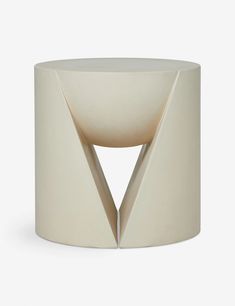 a white table with an unusual design on it's side and the top half cut out