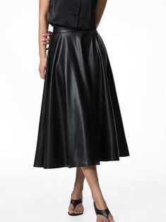 Vegan leather skirt in midi length with flared bottom. A Line style. Model is in MINUSEY ONE SIZE. ✔️ Free worldwide express shipping over $100✔️ Loved by 6,500+ customers✔️ Limited edition collections, maximum style⠀⠀⠀⠀⠀⠀⠀⠀⠀Stay ahead of the trend with can’t-find-anywhere-else staples. Your closet will thank you 💕 * MINUSEY ONE SIZE = EU 34-38, US 2-6* 100% PU Leather* Dry clean* Made in Korea - Model Height: 172cm/5'7" (US2, EU34) Chic Faux Leather Flared Skirt, Leather Pleated Skirt For Party, Leather Knee-length Lined Skirt, Spring Knee-length Leather Skirt, Party Leather Pleated Skirt, Chic Long Leather Skirt, Spring Leather Flared Skirt, Spring Leather Midi Skirt, Spring Leather Long Skirt