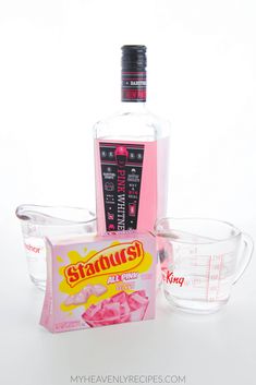 a bottle of liquor, measuring cup and other items on a white background with the words starbuds written in red