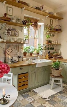 a kitchen filled with lots of pots and pans on top of it's shelves