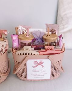 two pink baskets filled with personal care items