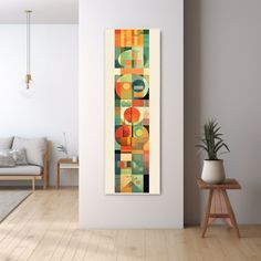 an abstract painting hangs on the wall in a living room