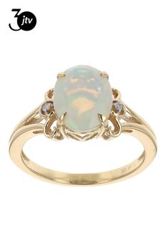 1.37ct Oval Ethiopian Opal With 0.02ctw Round White Diamond 10k Yellow Gold Ring. Measures Approximately 0.46"L x 0.39"W.