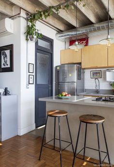 two stools are in front of the kitchen island