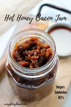 a jar filled with food sitting on top of a wooden table