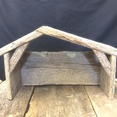 a small wooden structure sitting on top of a table