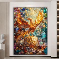 a painting on the wall of a living room with a large golden bird sitting on top of it