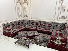 an ornately decorated couch with matching cushions