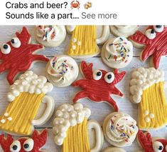 some decorated cookies are on a table with the caption crabs and beer? sounds like a part see more