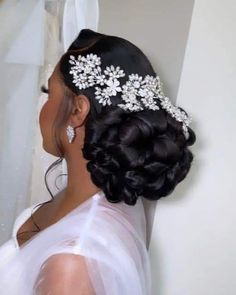 a woman wearing a bridal hair piece