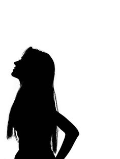 the silhouette of a woman with her hands on her hips