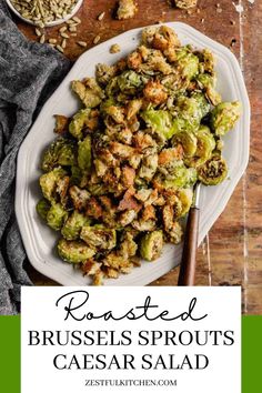 roasted brussel sprouts in a white plate with a serving spoon next to it