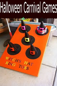 an orange sign that says witch hat ring toss on top of some sort of cones