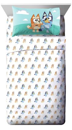 an image of a bed with two cartoon characters on the sheets and pillowcases