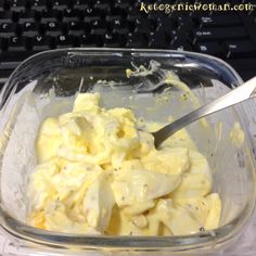 a plastic container filled with food next to a keyboard