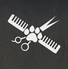 a pair of scissors, combs and paw prints on a black background with white outline