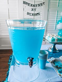 a blue drink is sitting on a table