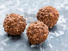 three chocolate balls are sitting on a gray surface with the words receita to dragon written above them