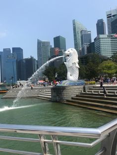 there is a fountain in front of the city