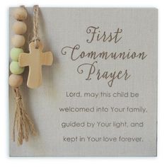 a wooden cross hanging on a wall with a poem written in the center that says, first communion prayer