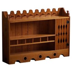 a wooden shelf with several compartments on it