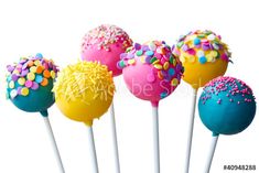 colorful cake pops with sprinkles on white sticks in front of a white background