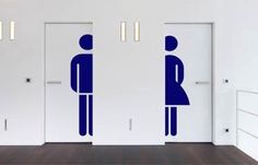 two blue men standing next to each other in an empty room with white walls and doors