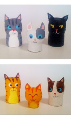 four different types of cats made out of toilet paper and plastic cups with eyes painted on them