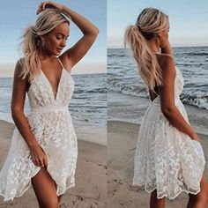 a woman standing on top of a beach next to the ocean wearing a white dress