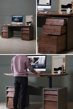 a man standing at a computer desk in front of a monitor