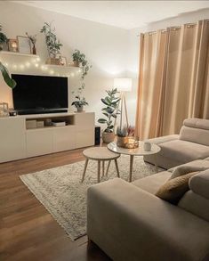 a living room filled with furniture and a flat screen tv