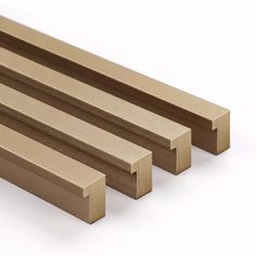 three pieces of wood sitting next to each other