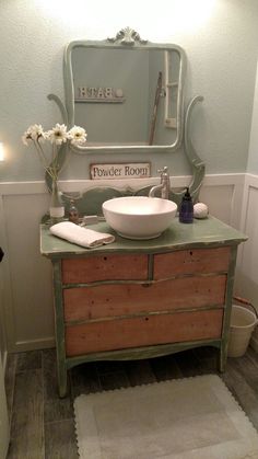 a bathroom with a sink, mirror and rug on the floor in front of it