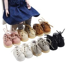 the doll is wearing several pairs of shoes