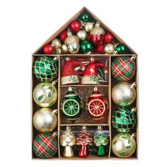 an assortment of christmas ornaments in a wooden display case on a white background with clippings