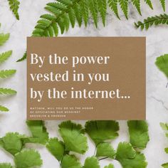 a card that says by the power vested in you by the internet on top of green leaves