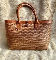 Handmade Rattan Handbags – Boho Living Room Rectangular Rattan Straw Bag With Braided Handles, Brown Rattan Tote Beach Bag, Chic Woven Leather Rattan Shoulder Bag, Handmade Casual Rattan Bags, Casual Handmade Rattan Bag, Chic Rattan Bags With Woven Leather, Bohemian Rattan Shoulder Bag With Braided Handles, Rectangular Brown Rattan Straw Bag, Brown Woven Rattan Bag