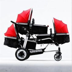 two baby strollers with red umbrellas sitting side by side against a white background