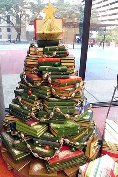 there is a christmas tree made out of books