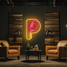 two chairs and a table in a room with a neon sign on the wall that says ping pong