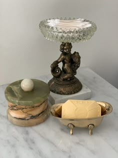 there are three different items on the table together, including an egg and soap dish